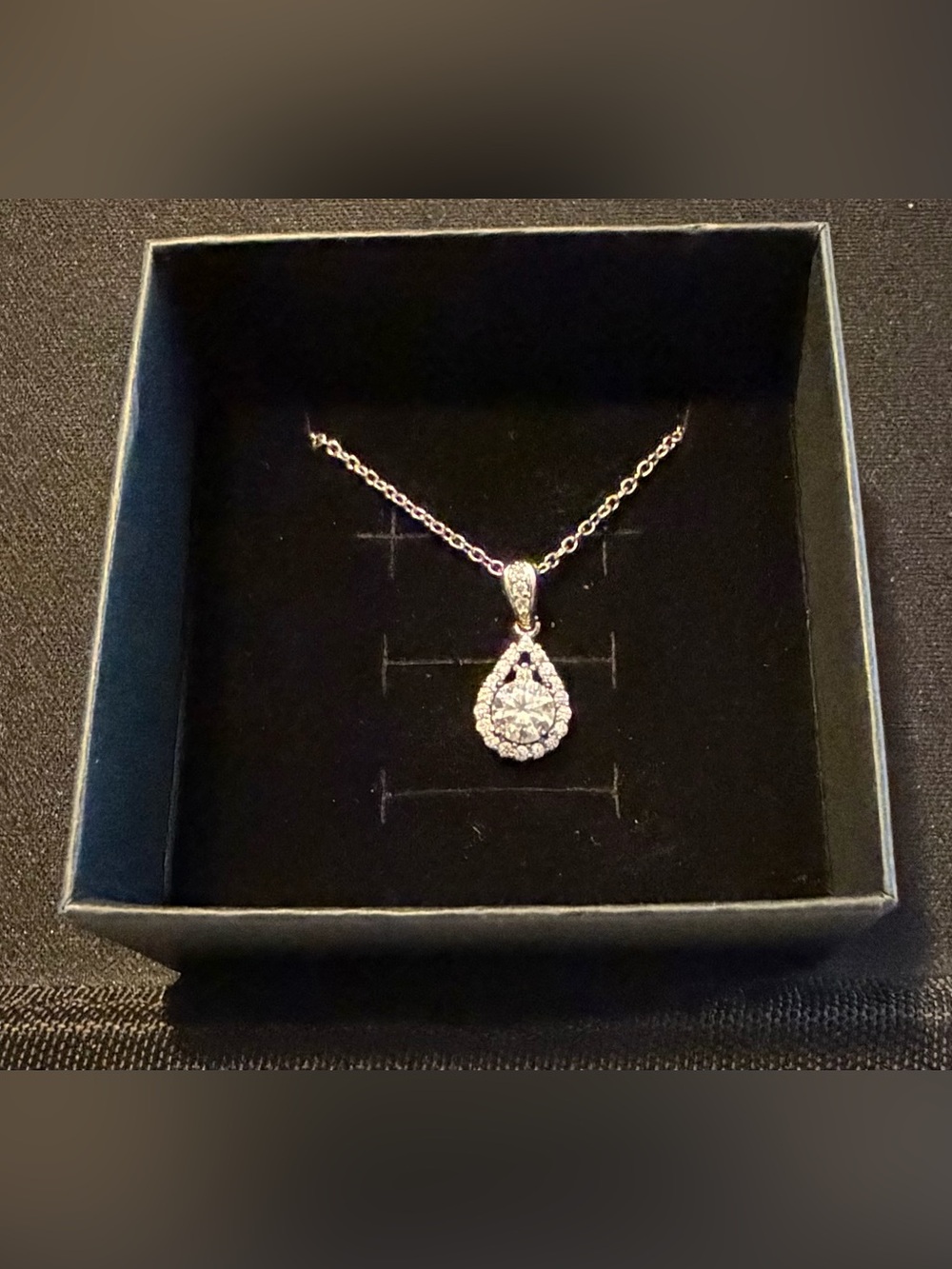 Elegant Silver Teardrop Pendant Necklace with Clear Stones -